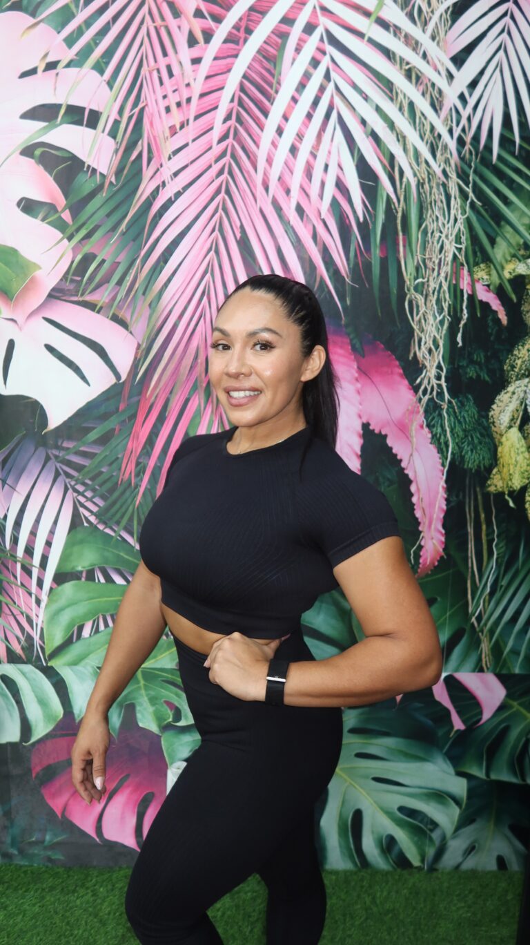 Portrait of Coach Dee, certified trainer and founder of LOVEHER