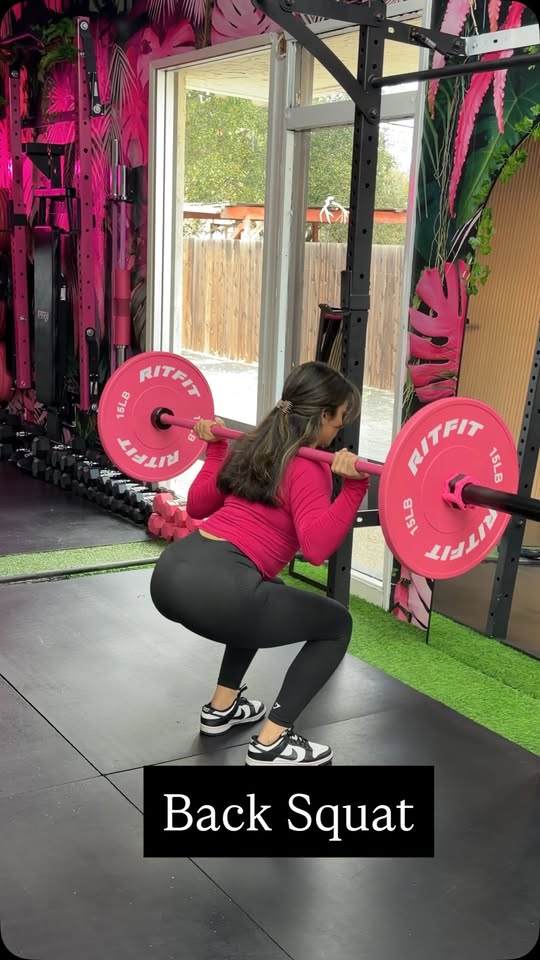 Coached strength on the LOVEHER lifting floor — sets with intention